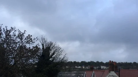 Moody clouds passing over small lonely town (+400%) Stock Footage 93866932