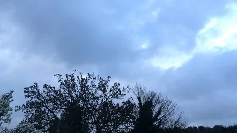 Moody clouds passing over small lonely town Stock Footage 93866935