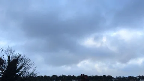 Moody clouds passing over small lonely town (+800%) Stock Footage 93866954