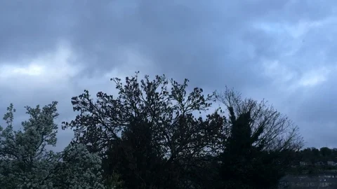 Moody clouds passing over small lonely town (longer) Stock Footage 93867016