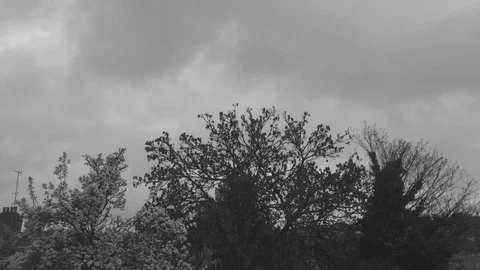 Moody clouds passing over small lonely town (+200%) Stock Footage 93867023