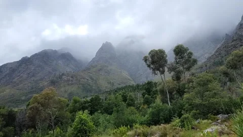 Moody Dark Clouds Rolling Down The Mountains Stock Footage 166945272