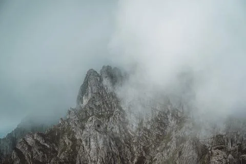 Moody green mountain landscape on a cloudy day in the italian Alps Stock Photos