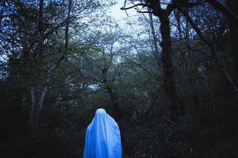 A moody horror edit of a ghost with a sheet over it's head. Stock Photos