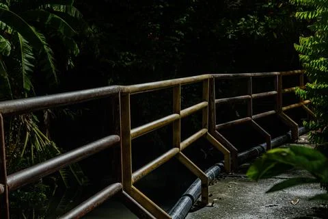 Moody low key rusty iron railing at night in dark environment Stock Photos