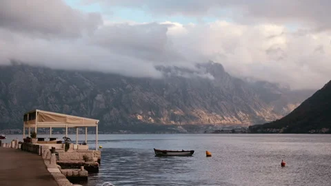 Moody Low Setting Sun Hitting Mountains in Bay, Perast, Montenegro Видео 337302496
