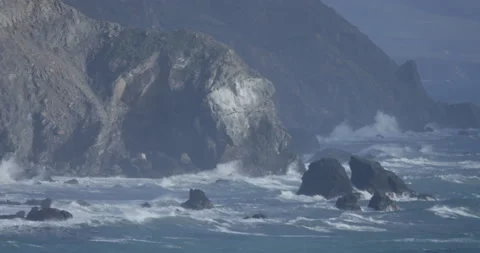 Moody Ocean Waves Against Rocks Video stock 192398482