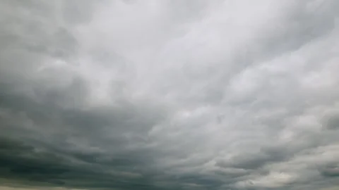 A Moody Overcast Sky Filled with Thick, Heavy Clouds Creating an Ominous Atmosph Stock Footage 312720013