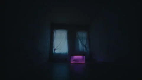 A moody room with diffused light and an aquarium emitting a purple glow. Stock Footage 299893759