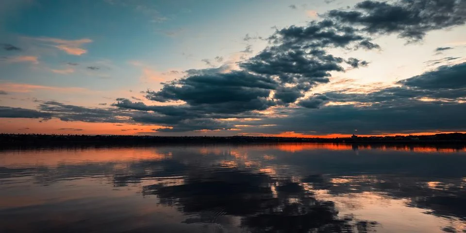 Moody Sunset River Cloud Reflection Stock Photos