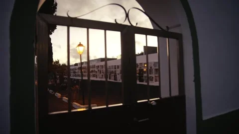 Moody Sunset View through Gate into Spanish Cemetery, El Hierro Stock Footage 316903156
