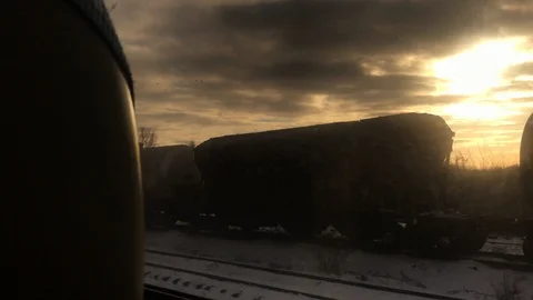 Moody sunset view from train window Stockbeeldmateriaal 124730787