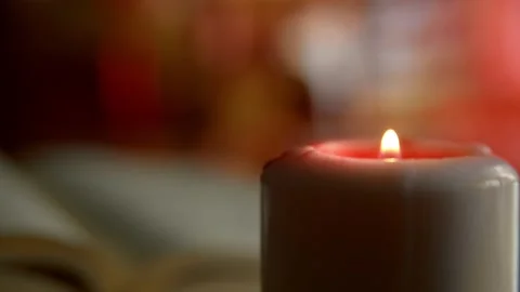 Moody view of burning candle on red moving background. Footage HD. Stock Footage 147292824