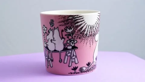 Moomin tea mug rotating on a table Stock Footage 239938570