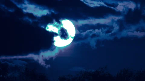The moon above forest close up time lapse video, strong zoom Stock Footage 48987708