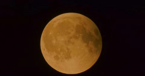 The moon after a total eclipse in a very strong close-up Stock Footage 316698054