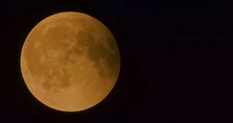 The moon after a total eclipse in a very strong close-up Stock Footage 316698259