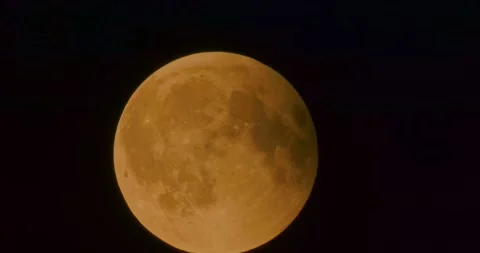The moon after a total eclipse in a very strong close-up Stock Footage 316698281