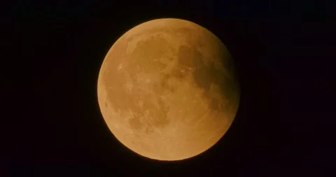 The moon after a total eclipse in a very strong close-up Stock Footage 316698467