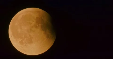 The moon after a total eclipse in a very strong close-up Stock Footage 316698756