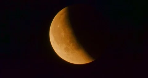 The moon after a total eclipse in a very strong close-up Stock Footage 316698842