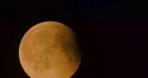 The moon after a total eclipse in a very strong close-up Stock Footage 316698873