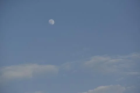 Moon and cloud on blue sky. Stock Photos