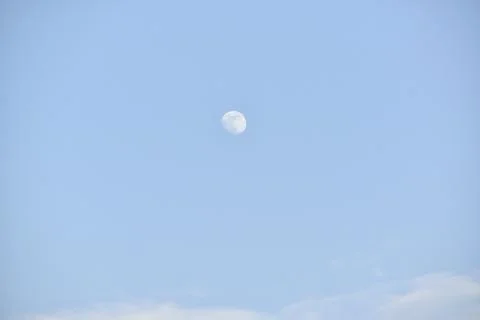 Moon and cloud on blue sky. Stock Photos