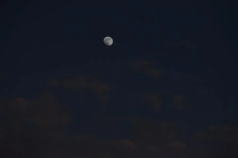Moon and cloud on blue sky. Stock Photos