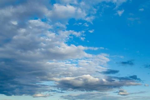 The moon and clouds in the blue evening sky. Natural background photo texture Stock Photos