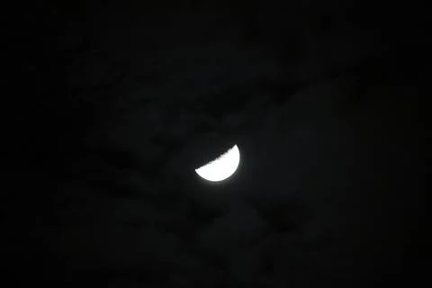 The moon and the clouds light by it Stock Photos