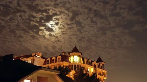 Moon and clouds over night hotel Stock Footage 54025128