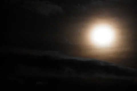 Moon and clouds in the sky. Stock Photos