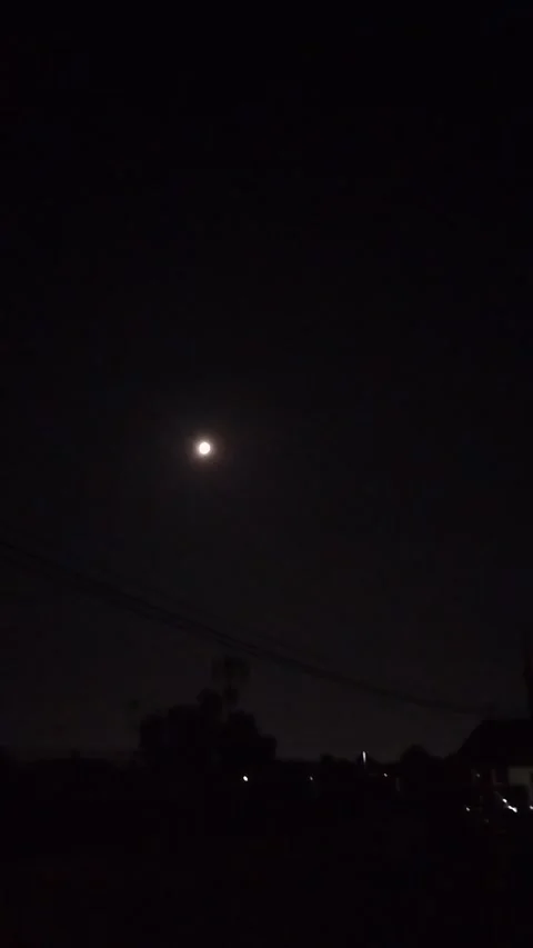 The moon and the lights on a quiet night Stock Footage 338227289