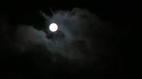 Moon and moving clouds in the night sky Stock Footage 54563240