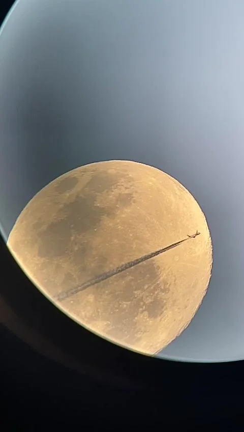 Moon and plane in space from telescope Stock Footage 278166960