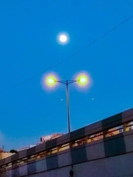 Moon and street light Stock Photos
