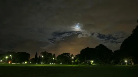 Moon and Thick Clouds over Park Stock Footage 11926481