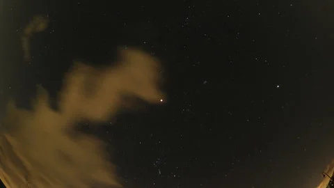 The Moon and Winter Constellations During a Total Lunar Eclipse Stock Footage 332478416