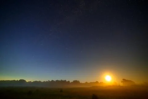 Moon on the background of the starry night sky. Stock Photos