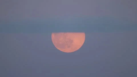 The moon behind the clouds, 4K slomo Stock Footage 170160072