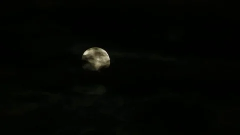 Moon behind clouds Stock Footage 77434449