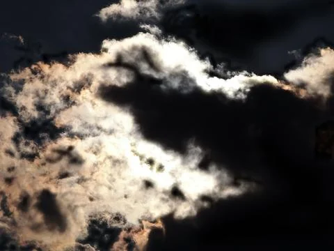 Moon behind the clouds Stock Photos