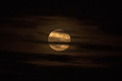 Moon behind the clouds Stock Photos