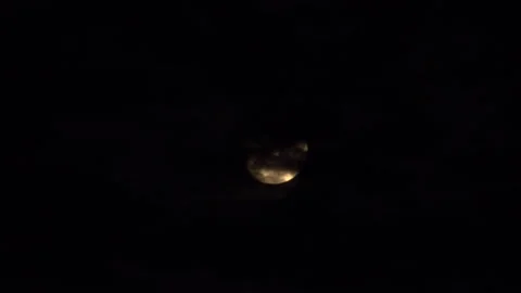 Moon being covered by clouds UK 4K Video stock 141132112