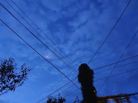 The moon between the cables in the blue sky - Lilleaker Stock Photos