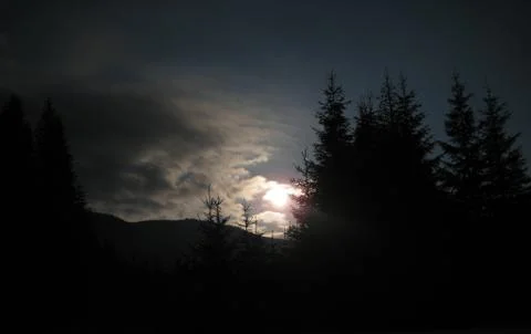 Moon between clouds Stock Photos