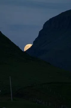 Moon between mountains Stock Photos