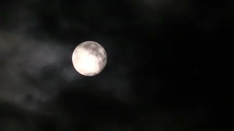 The moon on the black night sky and floating clouds Видео 40042193