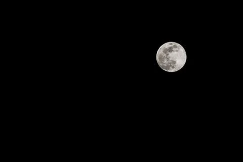 Moon in black sky Stock Photos